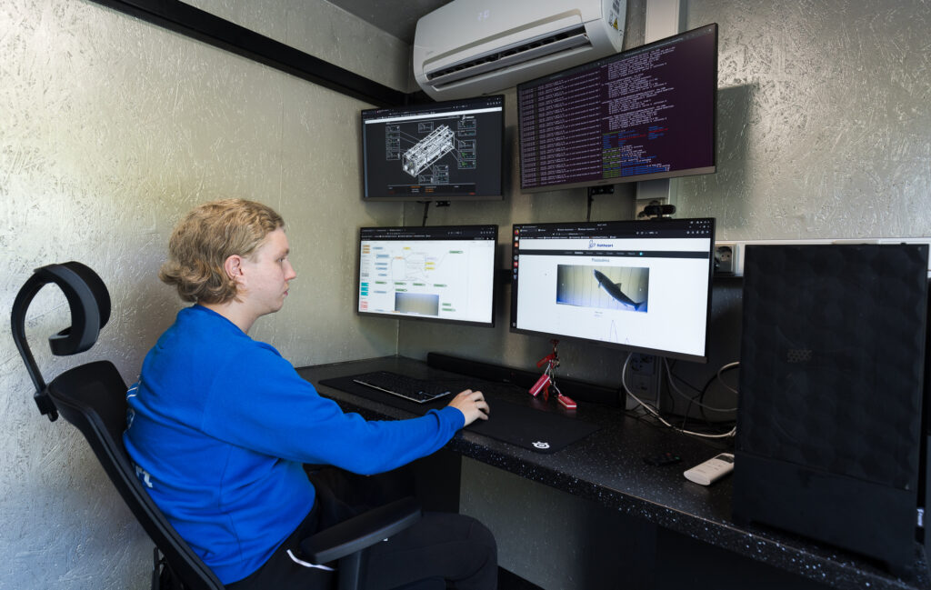 IT-specialist Samuli Ukkola is observing the operation of the Fisheart fishway in the control room.